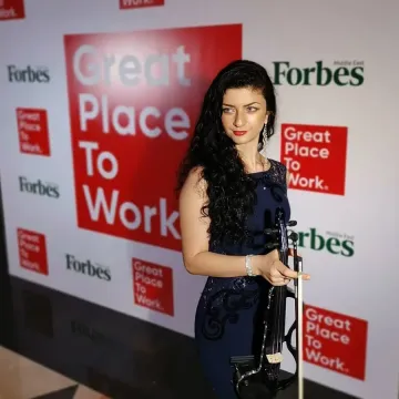 Anna Petrasian performing at Forbes Great Place to Work event